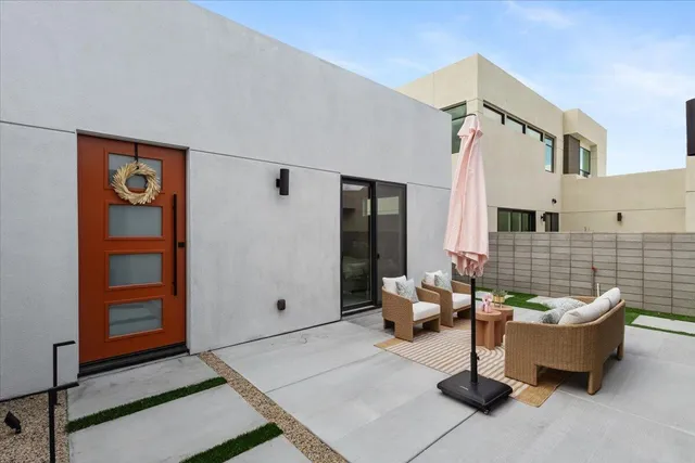 a outdoor space with patio furniture and a potted plant