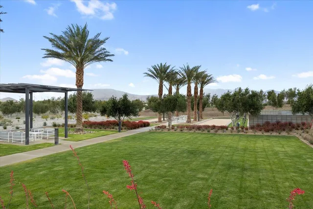 a view of a swimming pool with a table and chairs