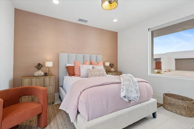 a bedroom with a bed and couch