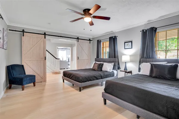 a bedroom with bed and a couch