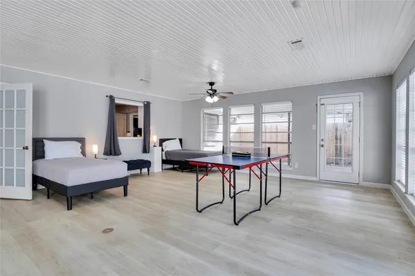 a living room with furniture a window and a table