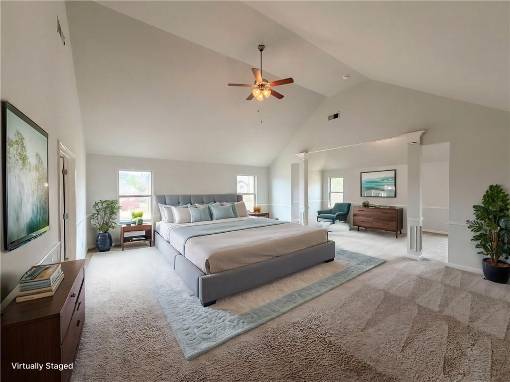 1549 Harlequin Way Stockbridge, GA 30281 - Photo 14 of 30 a bedroom with a large bed couch and a flat tv screen