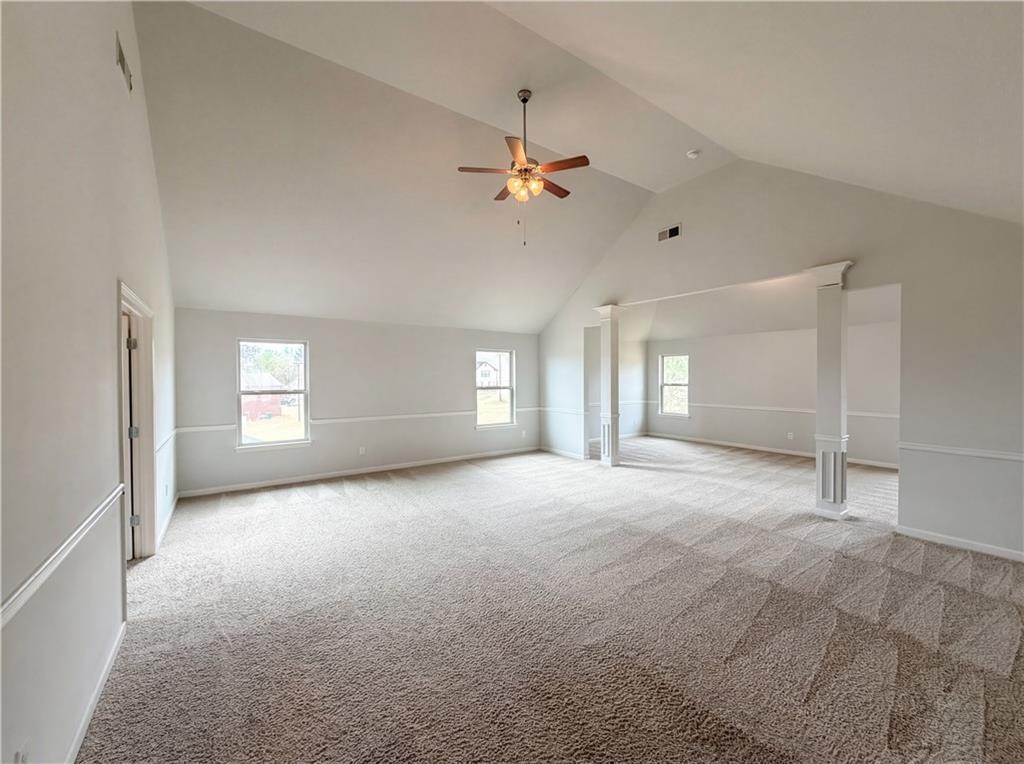 1549 Harlequin Way Stockbridge, GA 30281 - Photo 15 of 30 a view of a big room with a ceiling fan and a window