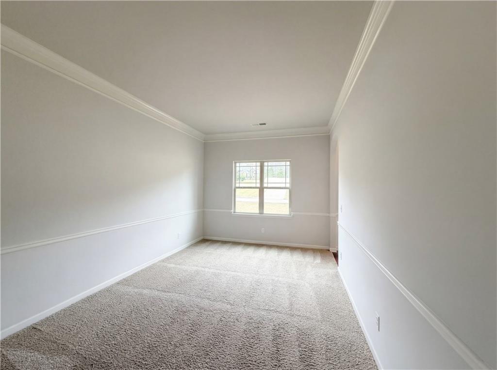1549 Harlequin Way Stockbridge, GA 30281 - Photo 22 of 30 a view of an empty room with a window