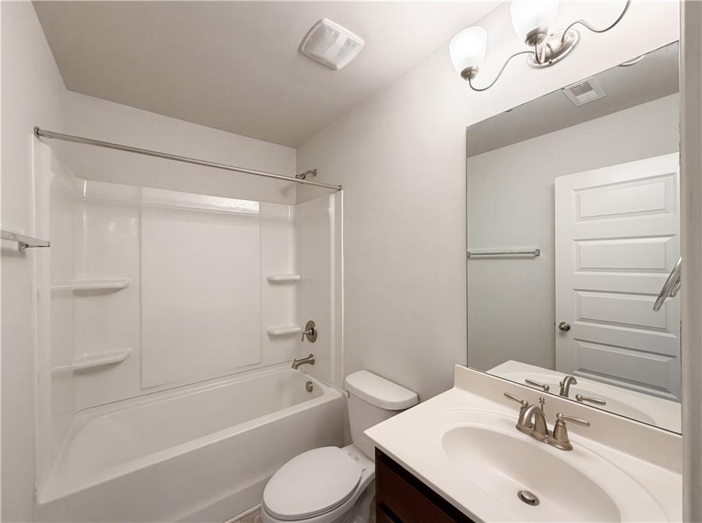 1549 Harlequin Way Stockbridge, GA 30281 - Photo 26 of 30 a bathroom with a sink toilet and shower