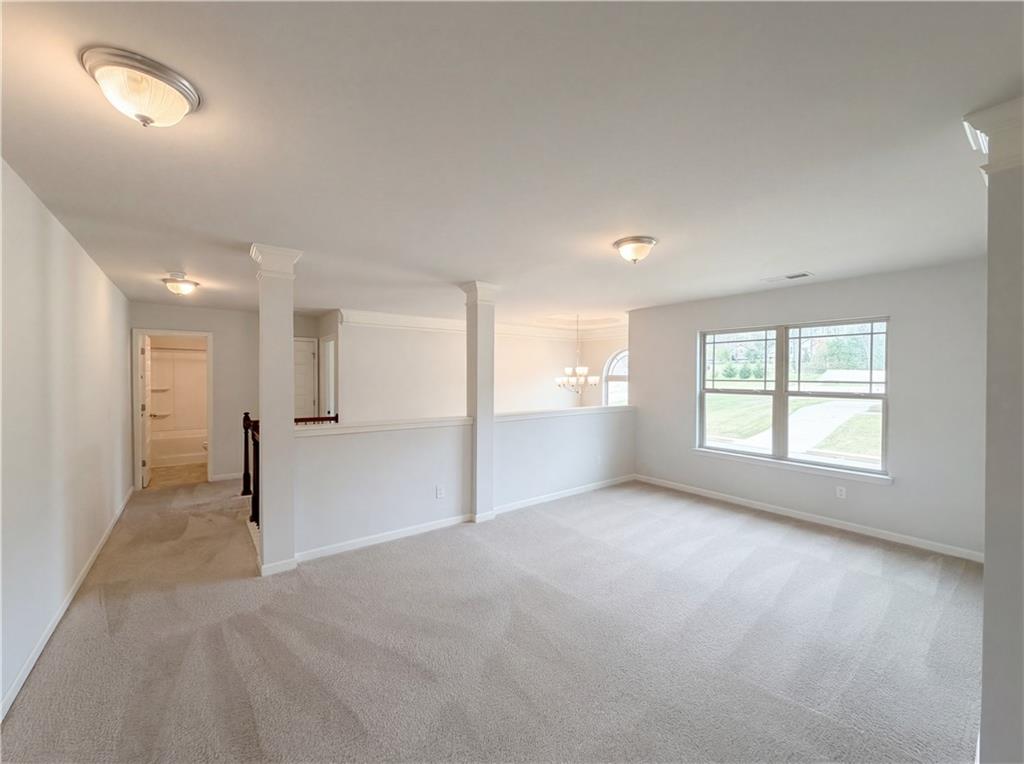 1549 Harlequin Way Stockbridge, GA 30281 - Photo 27 of 30 a view of empty room with wooden floor and fan