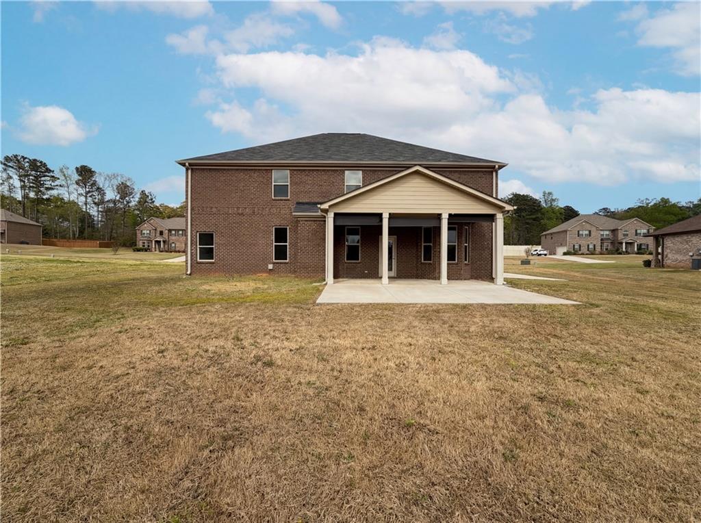 1549 Harlequin Way Stockbridge, GA 30281 - Photo 30 of 30 a front view of a house with garden