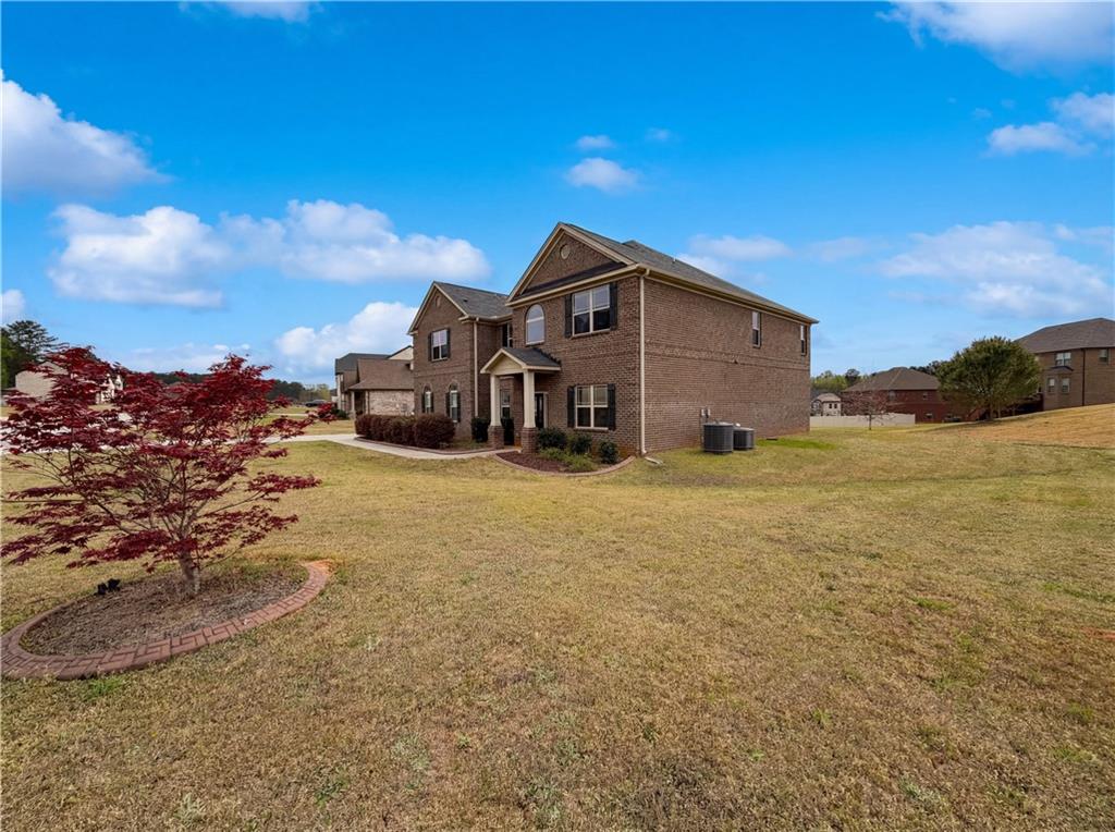 1549 Harlequin Way Stockbridge, GA 30281 - Photo 3 of 30 a view of a house with a yard