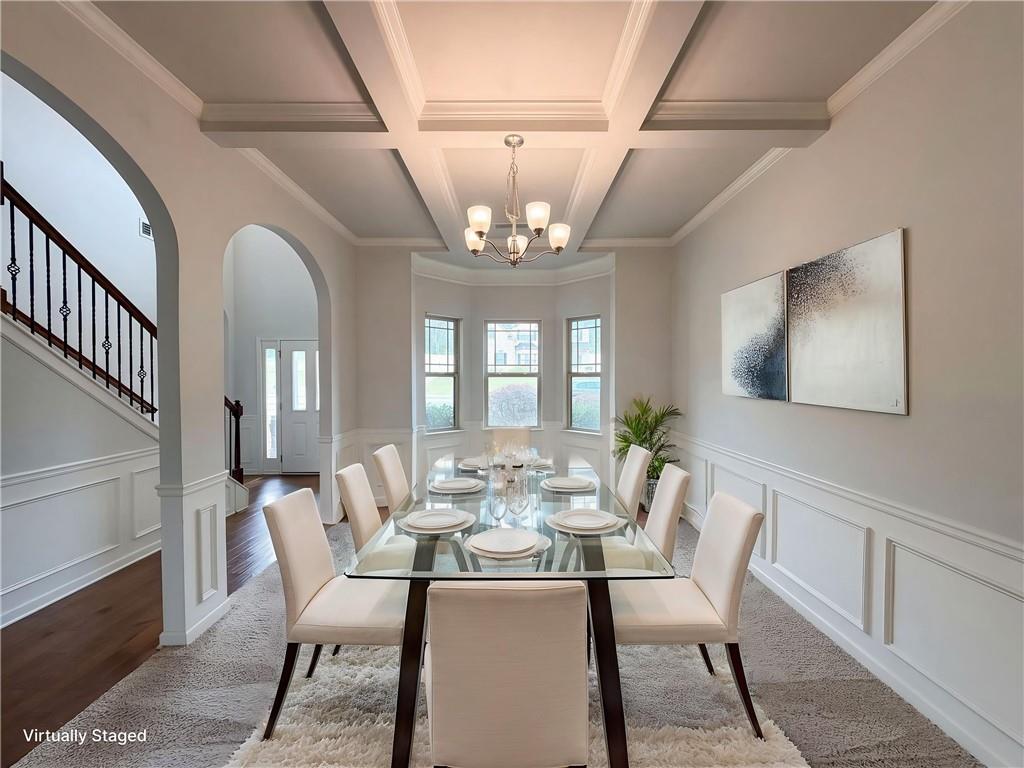 1549 Harlequin Way Stockbridge, GA 30281 - Photo 5 of 30 a view of a dining room with furniture a chandelier and wooden floor