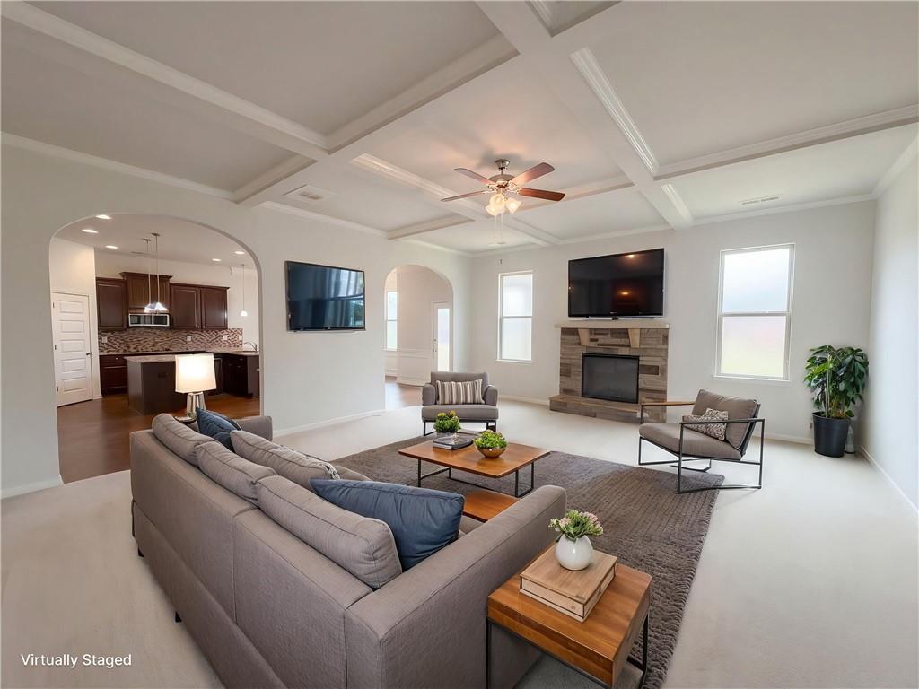 1549 Harlequin Way Stockbridge, GA 30281 - Photo 7 of 30 a living room with furniture fireplace and a flat screen tv