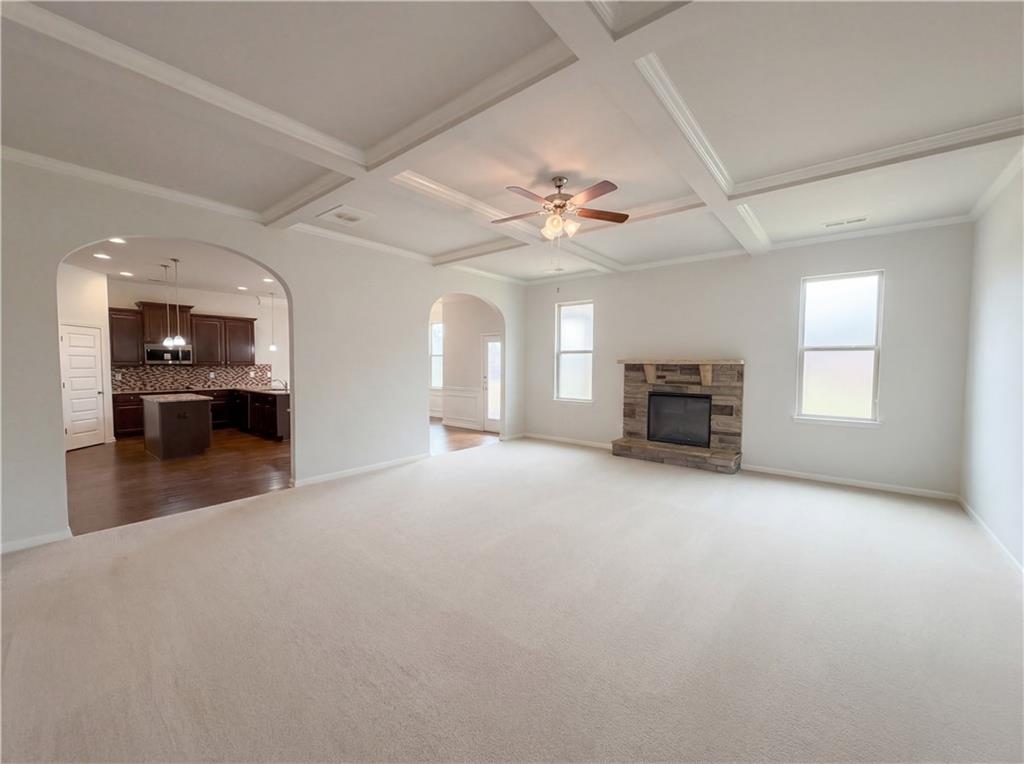 1549 Harlequin Way Stockbridge, GA 30281 - Photo 8 of 30 an empty room with furniture and a chandelier fan