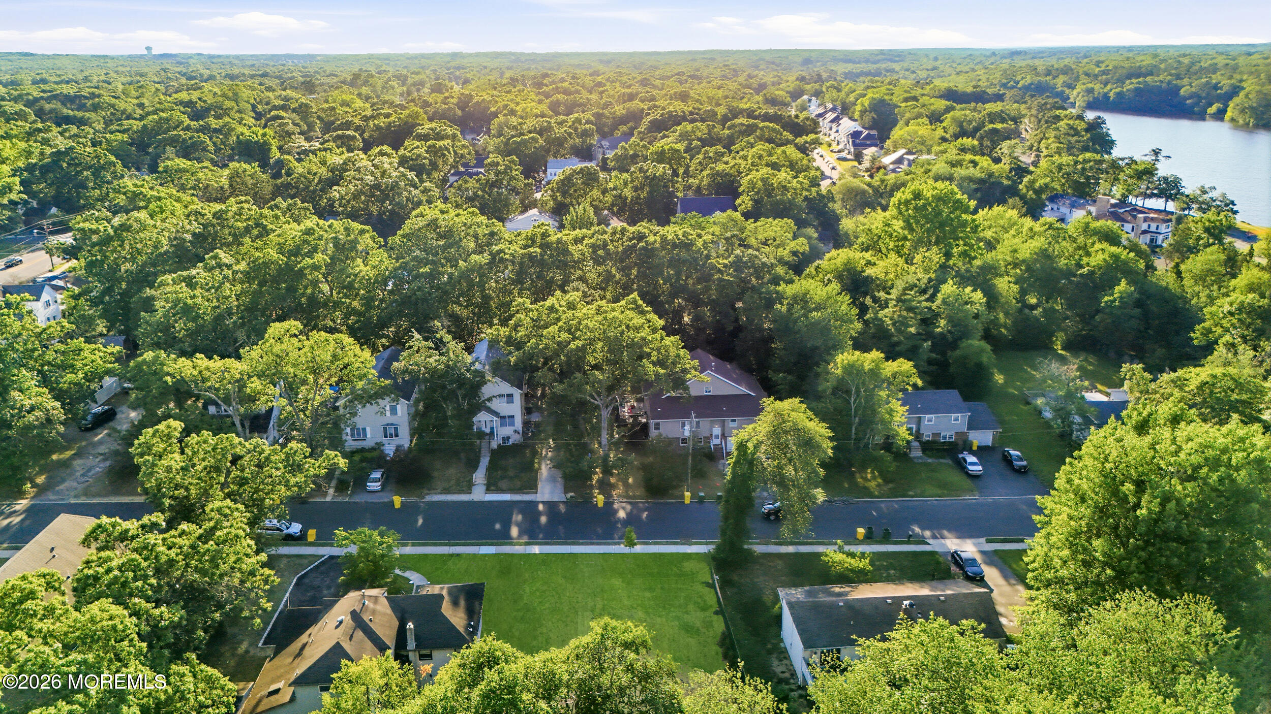 41 Sunset Road Lakewood, NJ 08701 - Photo 6 of 8 an aerial view of residential houses with outdoor space and trees