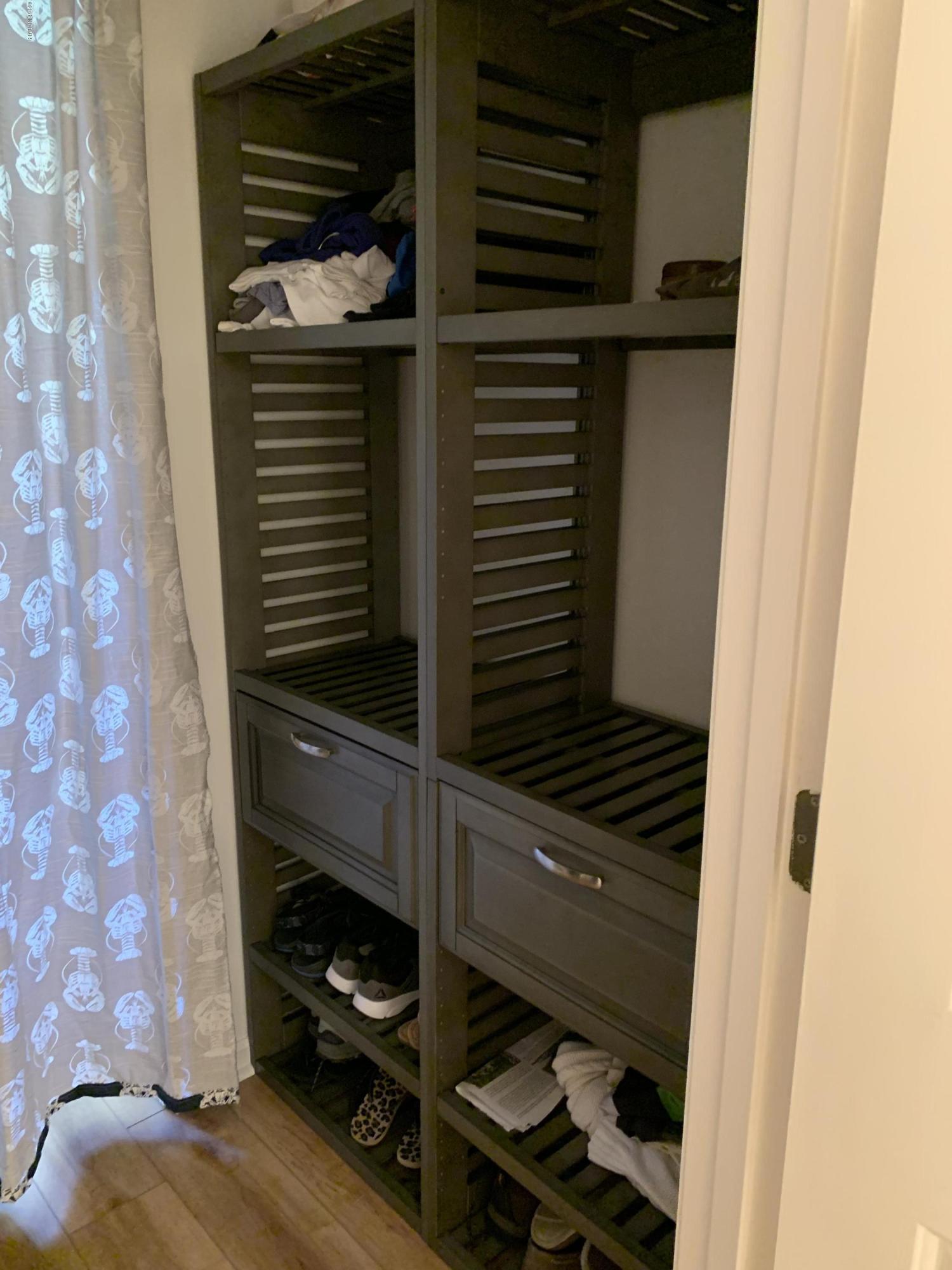 213 Clubhouse Road, Unit 3 Sunset Beach, NC 28468 - Photo 23 of 33 Master bedroom closet built in.