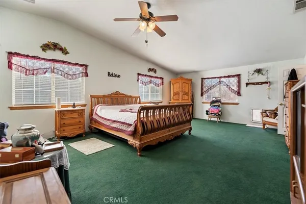 a bedroom with a bed and a closet