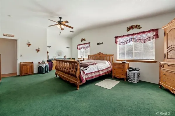 a bathroom with a tub sink toilet and window