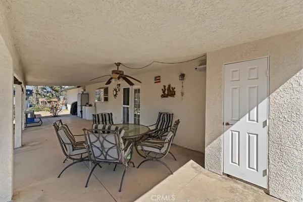 a view of a backyard with sitting area