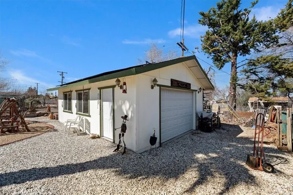 a view of a house with backyard porch and furniture