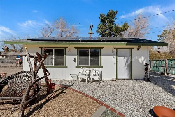 a view of a swimming pool with a yard