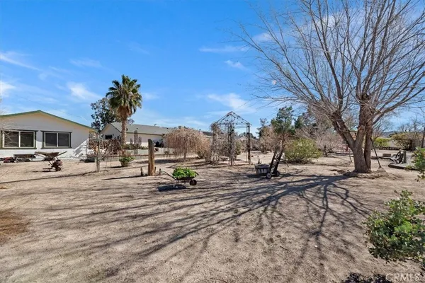 a view of a backyard of a house