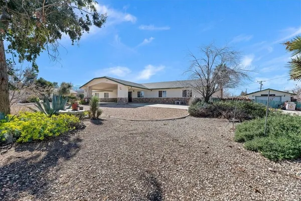 a house view with a garden space