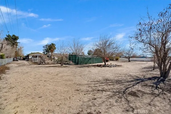 a view of a backyard of the house