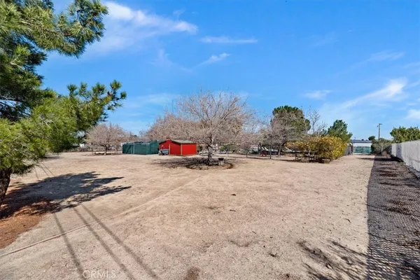 a swimming pool with outdoor seating and yard