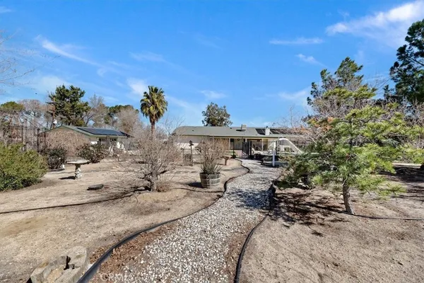 a view of a swimming pool with a patio