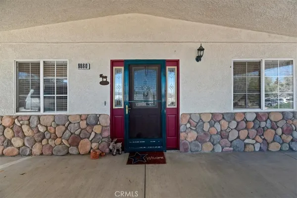 a view of a livingroom with furniture and windows