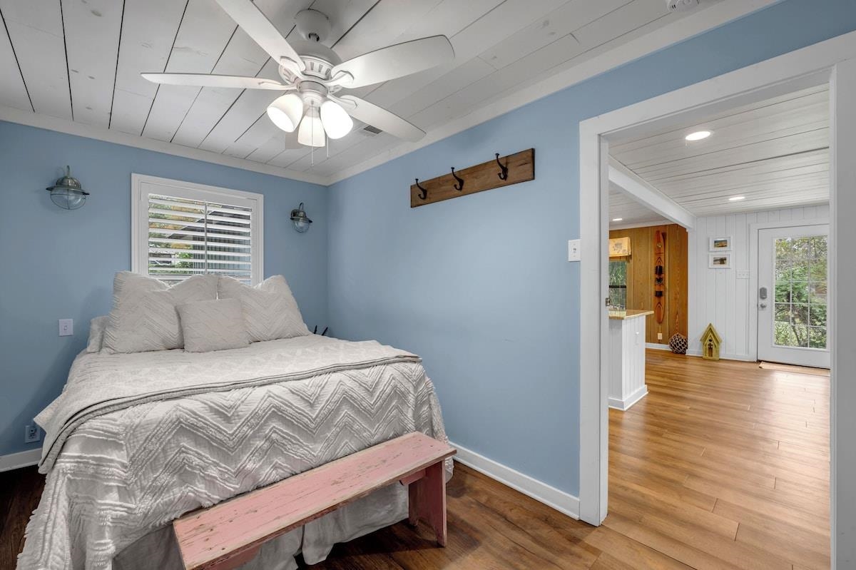 200 Highland Loop Kingsland, TX 78639 - Photo 12 of 23 a bedroom with a large bed and wooden floor