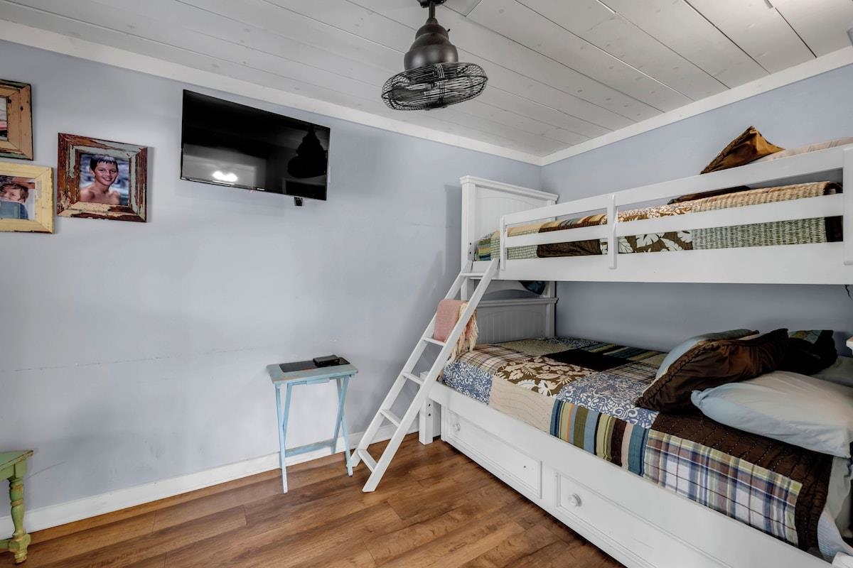 200 Highland Loop Kingsland, TX 78639 - Photo 13 of 23 a bedroom with a bed and a flat screen tv