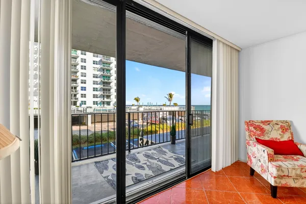 a kitchen with stainless steel appliances kitchen island granite countertop a refrigerator and a stove top oven