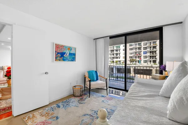 a living room with furniture and a rug