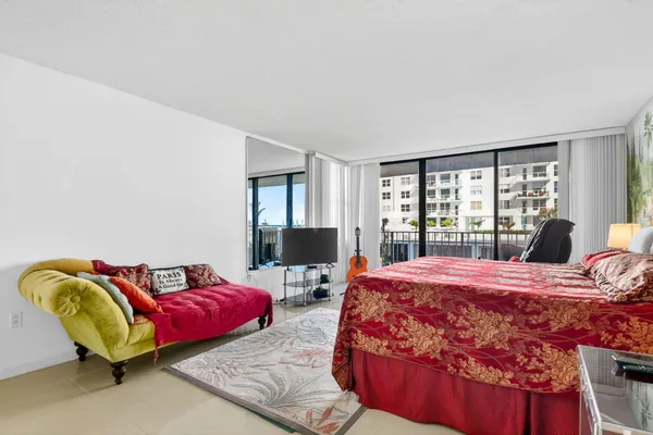 a bedroom with furniture and a window