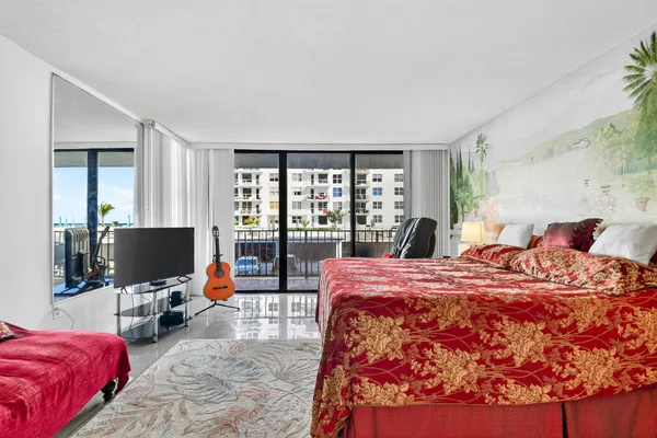 a bed room with a bed and a chair