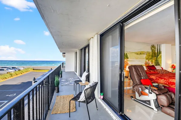 a balcony with furniture and city view