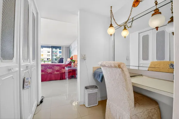 a bathroom with a sink mirror and vanity