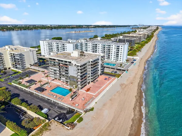 a view of a swimming pool with an outdoor seating