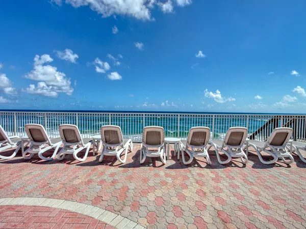 a view of a chairs and tables in the terrace
