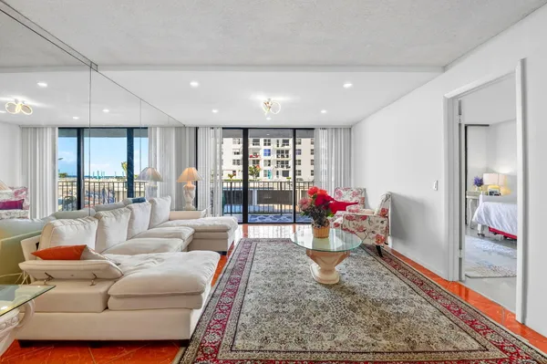a living room with furniture and a rug