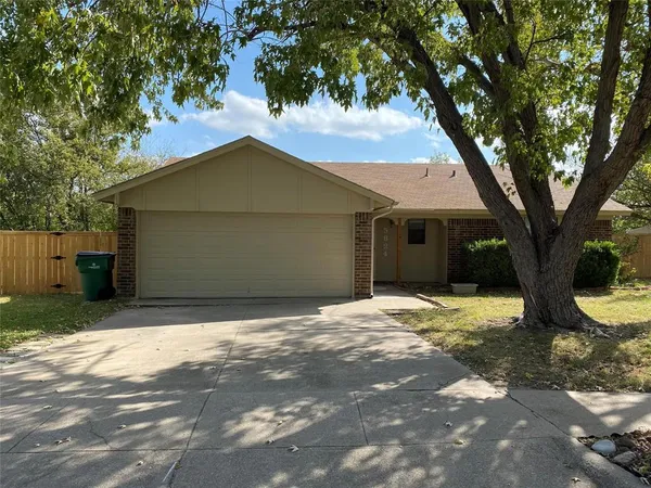 a house with a tree in front of it