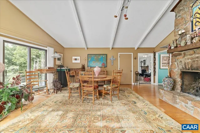 a kitchen with stainless steel appliances granite countertop a stove and a white cabinets