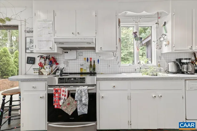 a view of backyard with seating space and wooden floor