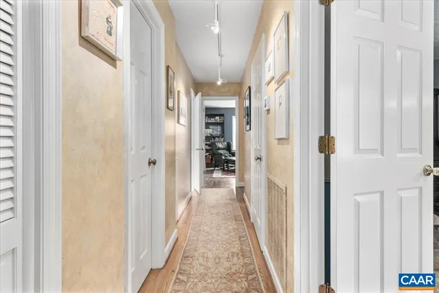 a bathroom with a toilet and a shower curtain