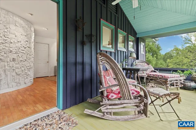 a view of a house with a yard and sitting area