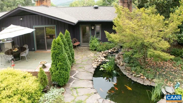 a living room with furniture a piano and a fireplace