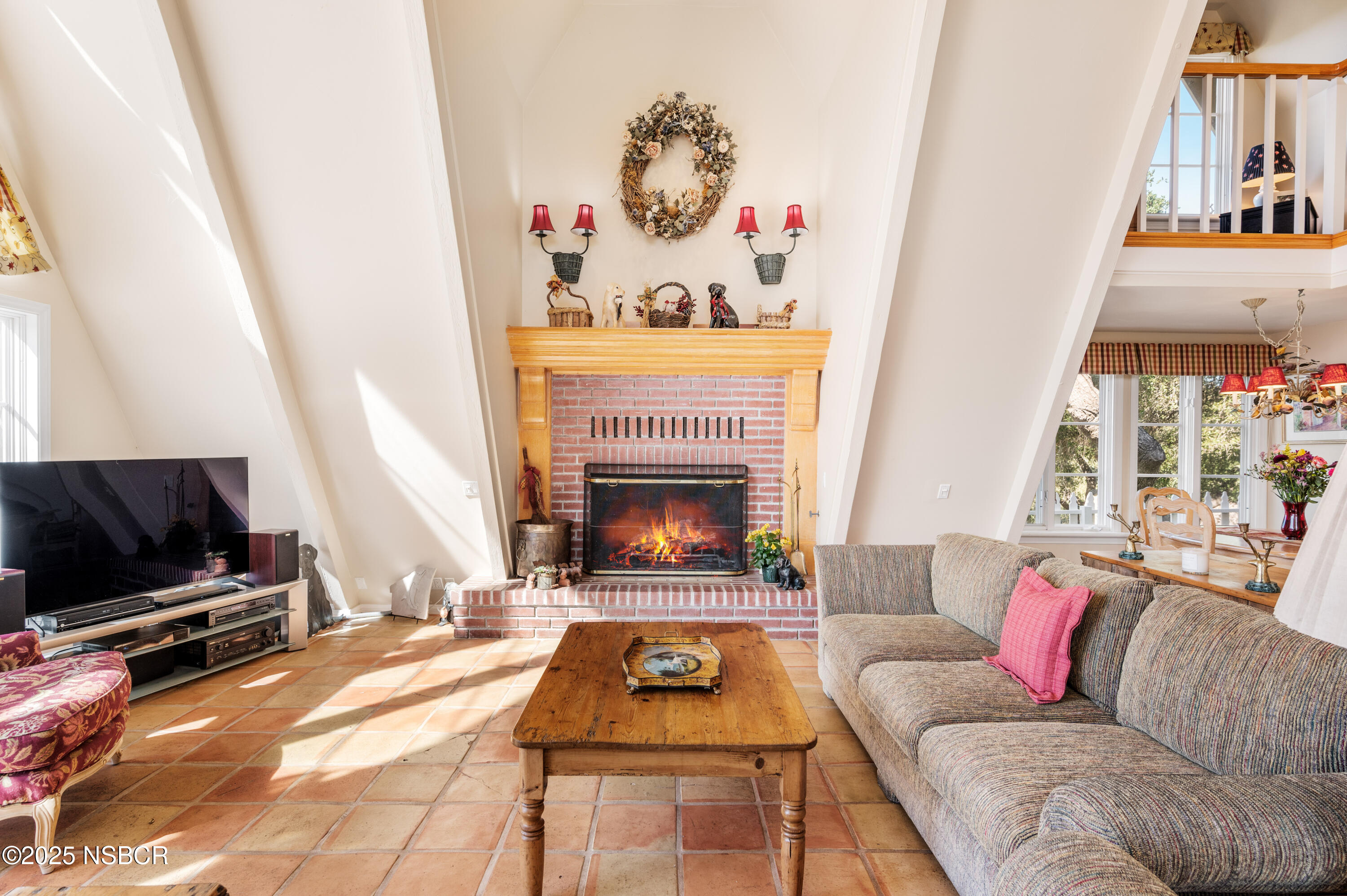 4086 East Oak Trail Road Santa Ynez, CA 93460 - Photo 10 of 57 a living room with furniture and a fireplace