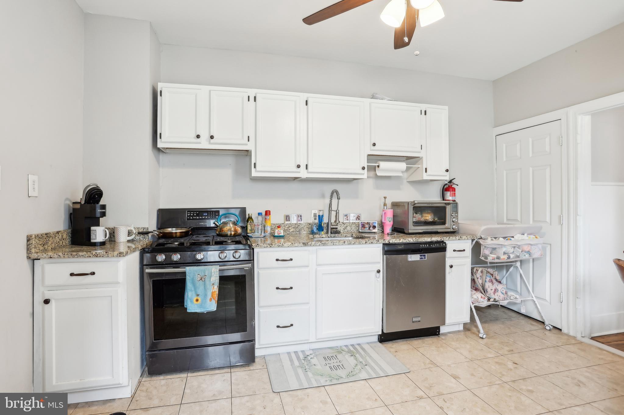 705 Burlington Avenue Delanco, NJ 08075 - Photo 12 of 41 a kitchen with stainless steel appliances granite countertop a stove and a refrigerator