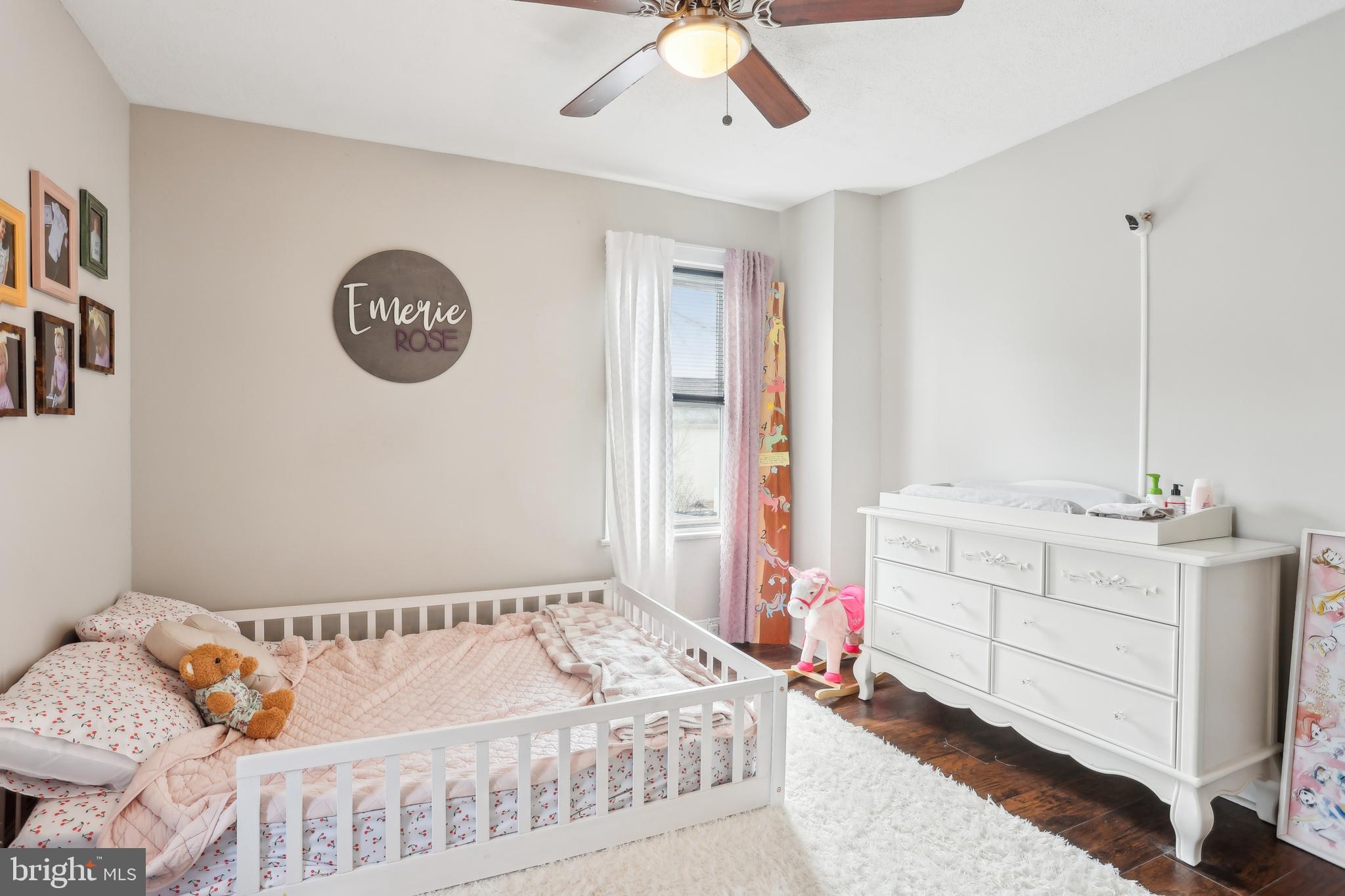 705 Burlington Avenue Delanco, NJ 08075 - Photo 19 of 41 a bedroom with a bed and a chandelier