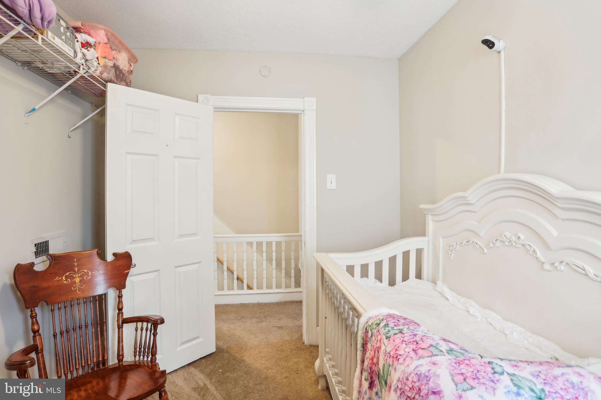 705 Burlington Avenue Delanco, NJ 08075 - Photo 21 of 41 a bedroom with a bed and a chair