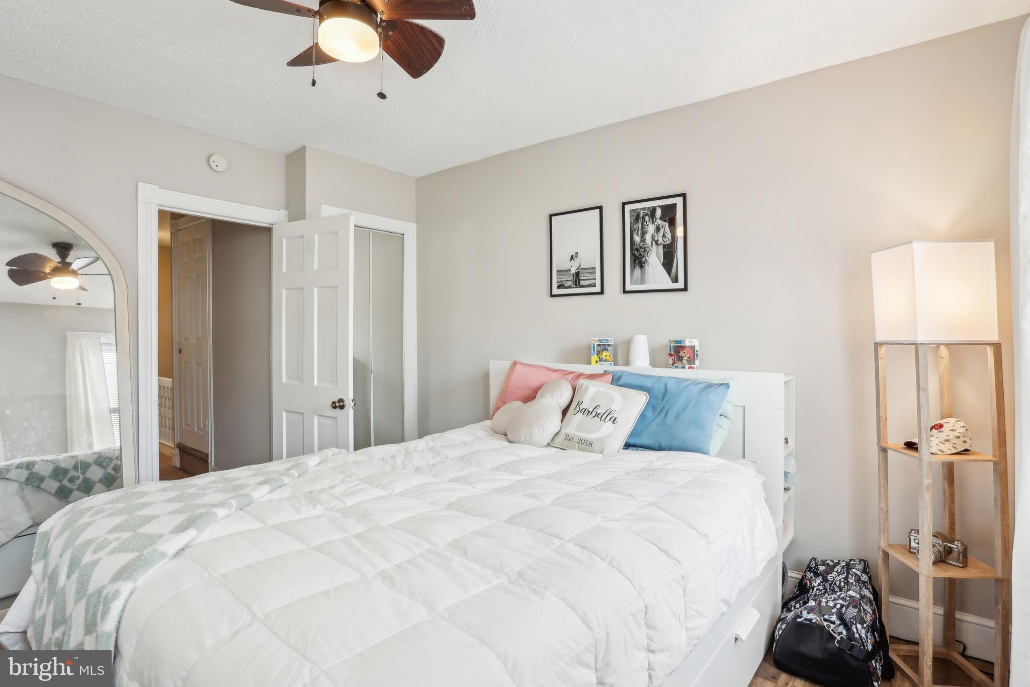 705 Burlington Avenue Delanco, NJ 08075 - Photo 25 of 41 a bedroom with a large bed and a chandelier